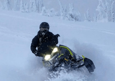 Snowmobiling near Peaks Lodge in Revelstoke, BC