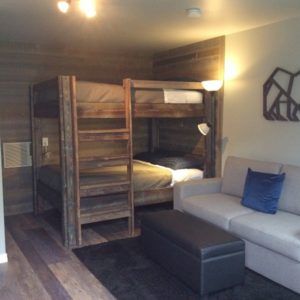 Bunk bed and sitting area at Peaks Lodge in Revelstoke, BC