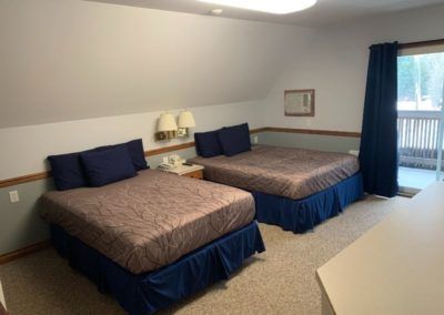 Sleeping area of room at Peaks Lodge in Revelstoke, BC